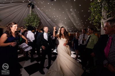 dorset traditional pole marquee with ivory starlight ceiling and black and white dance floor