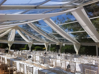 dorset wedding Clear roofs and hex end, white drapes, fairy lights and long tables
