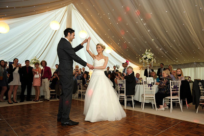 First dance as husband and wife beneath an ivory starlight ceiling
