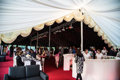 Traditional marquee with rubin red carpet, reveal curtain and black starlight ceiling
