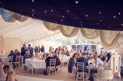 dorset wedding marquee with black starlight ceiling, white dance floor and fairy lights